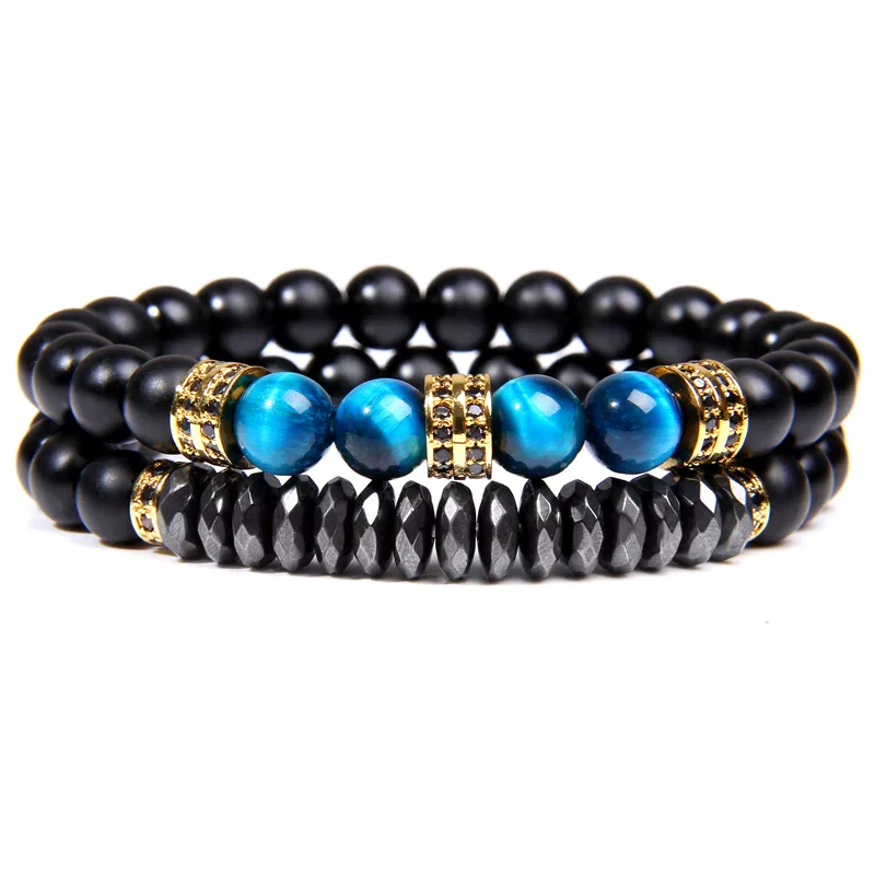 Beaded bracelet set with black, blue, and gold accents for men. Stylish jewelry accessory for casual.