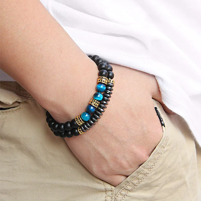 Bracelet set featuring black and blue natural stone beads with gold accents for men.