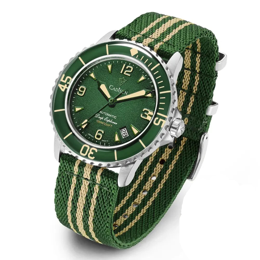 Men's green dial dive watch with stainless steel case and fabric strap.