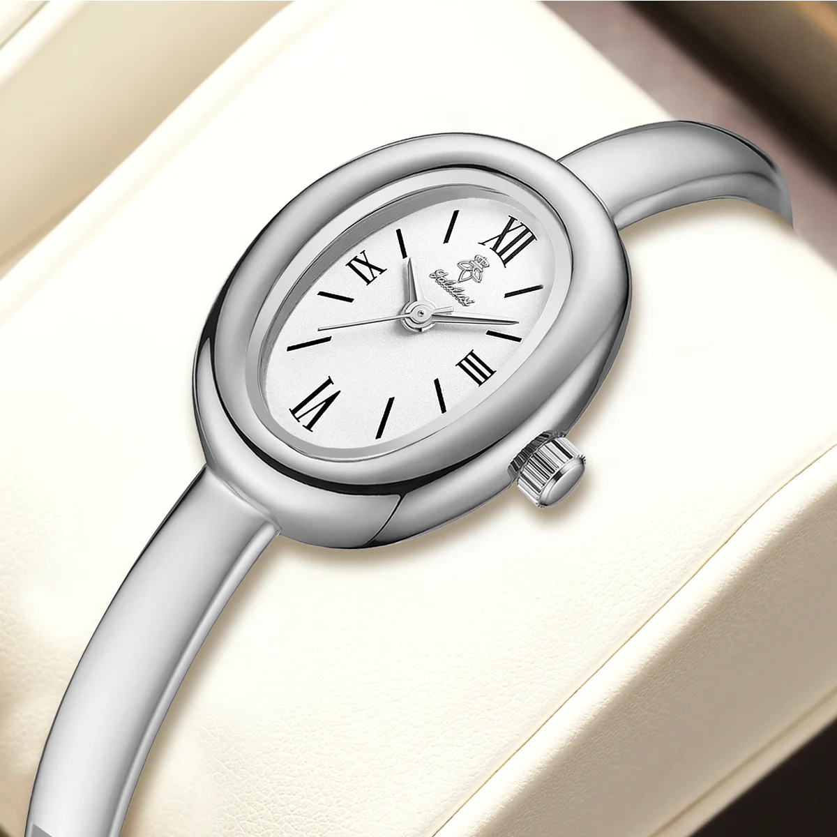 Roman numeral bracelet watch with a sleek silver finish for women.