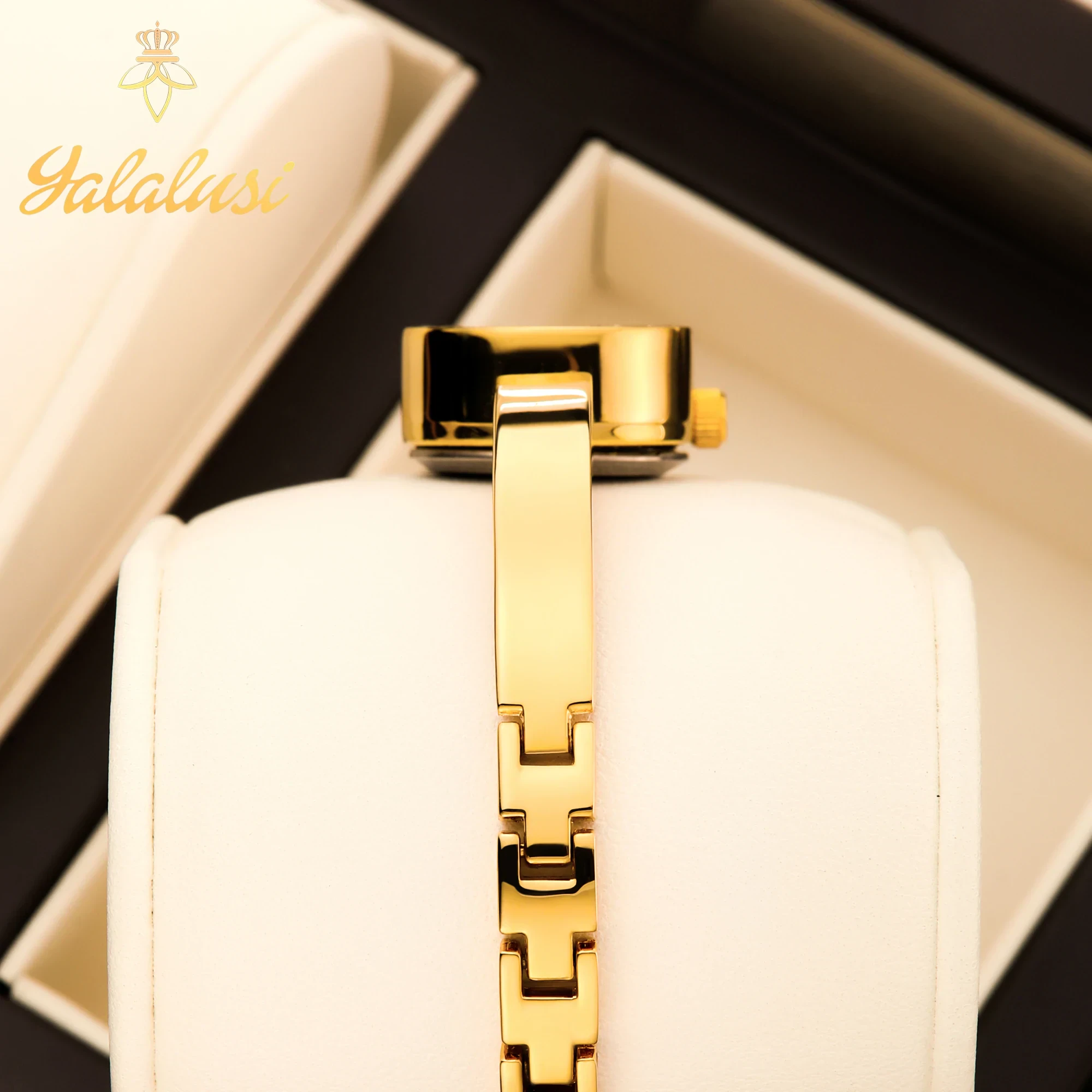 Elegant oval dial gold-tone bracelet watch for women.