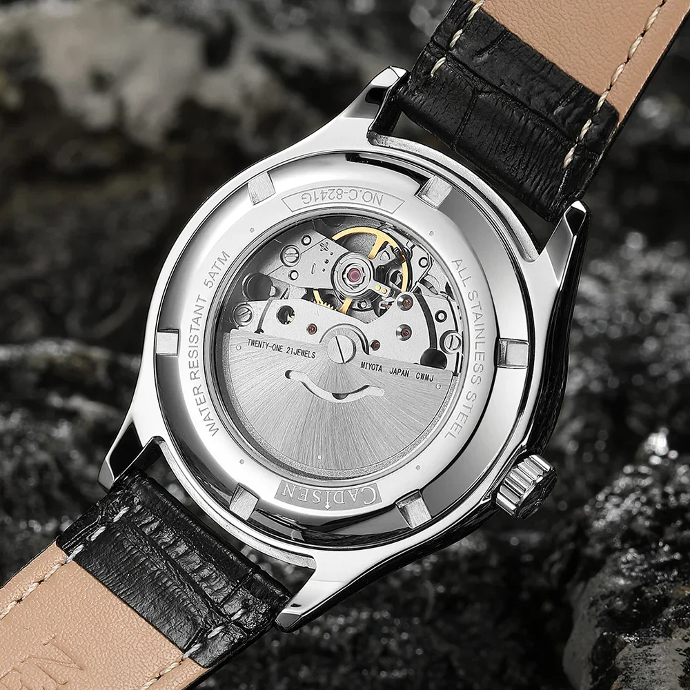 Automatic watch with transparent back showing movement.