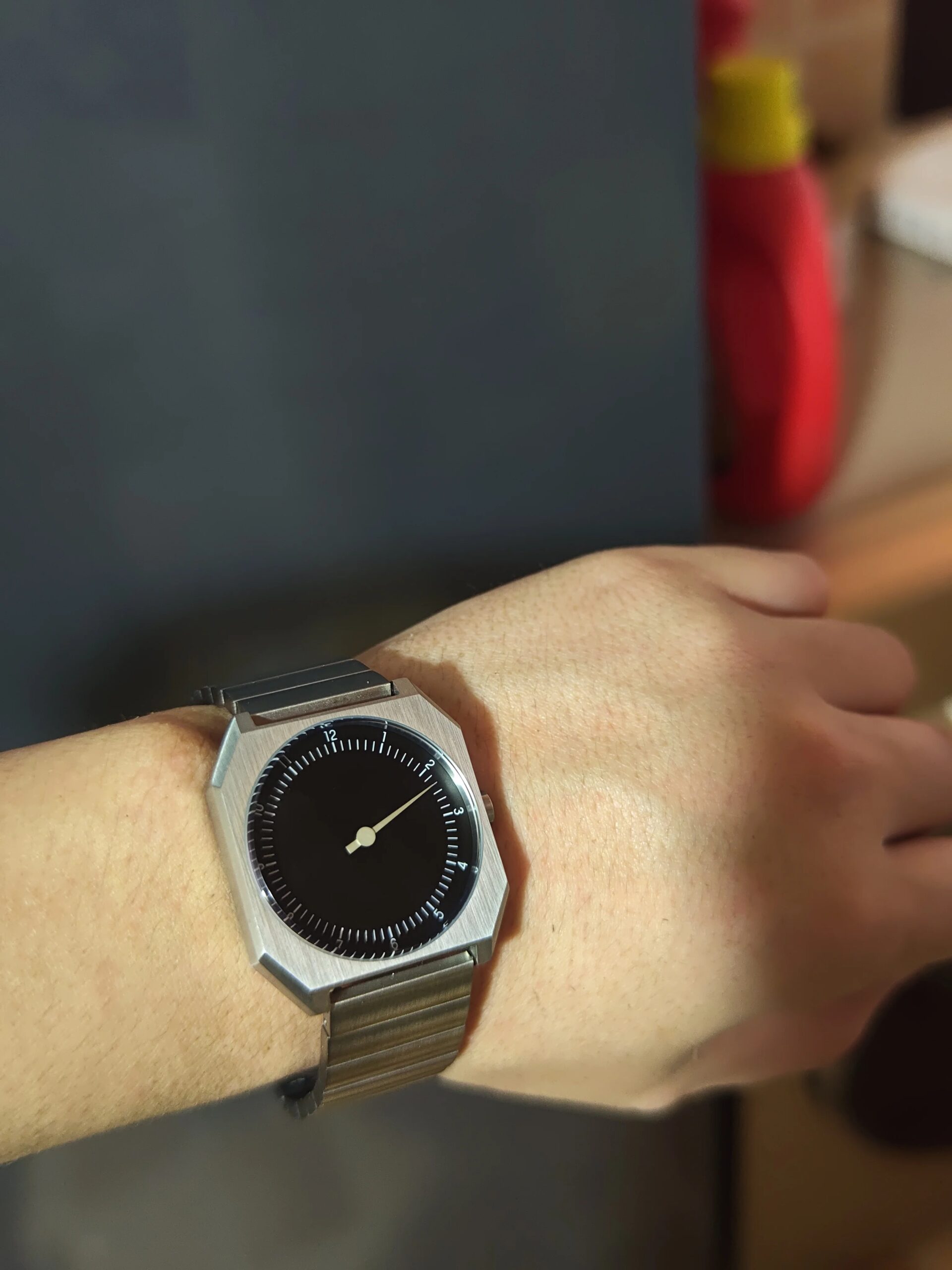 Elegant men's wristwatch with a sleek black dial and silver-tone case. Perfect for fashion-forward a.