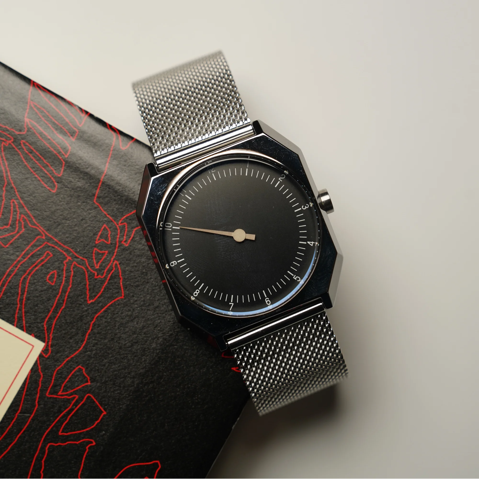 Elegant men's vintage square watch with a sleek black dial and stainless steel mesh band. Perfect fo.
