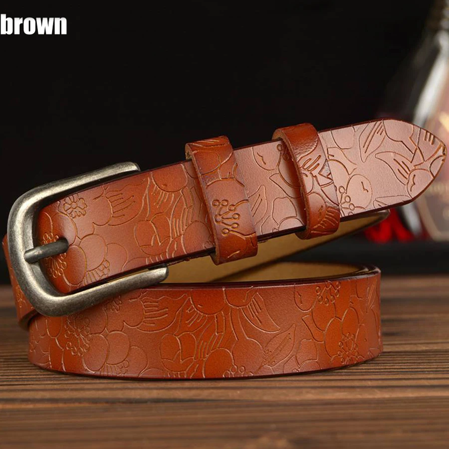 Women's genuine leather belt with floral carved design.