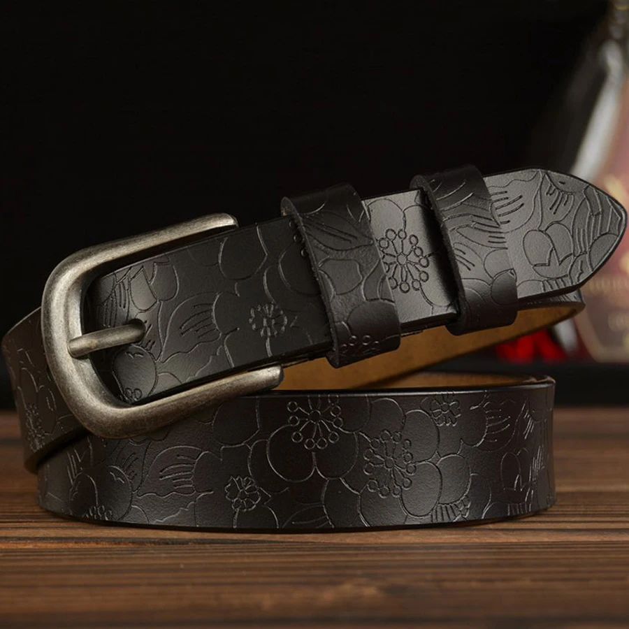 Genuine leather belt with floral carved design, perfect for women's fashion. Durable and stylish acc.