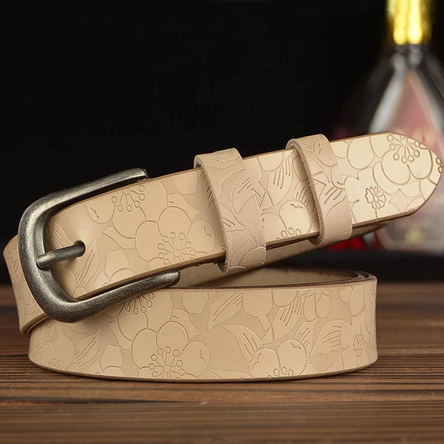 Genuine leather women's belt with floral carved pattern, stylish and durable accessory. Perfect for.