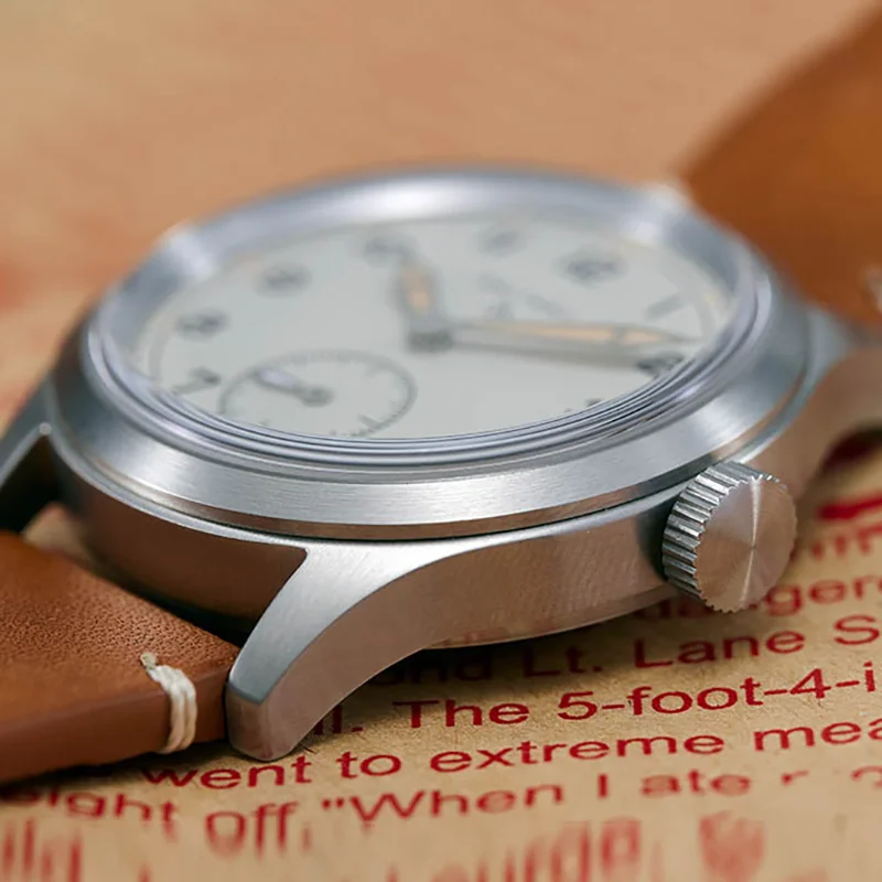 Quartz Field Watch with leather strap and stainless steel case.