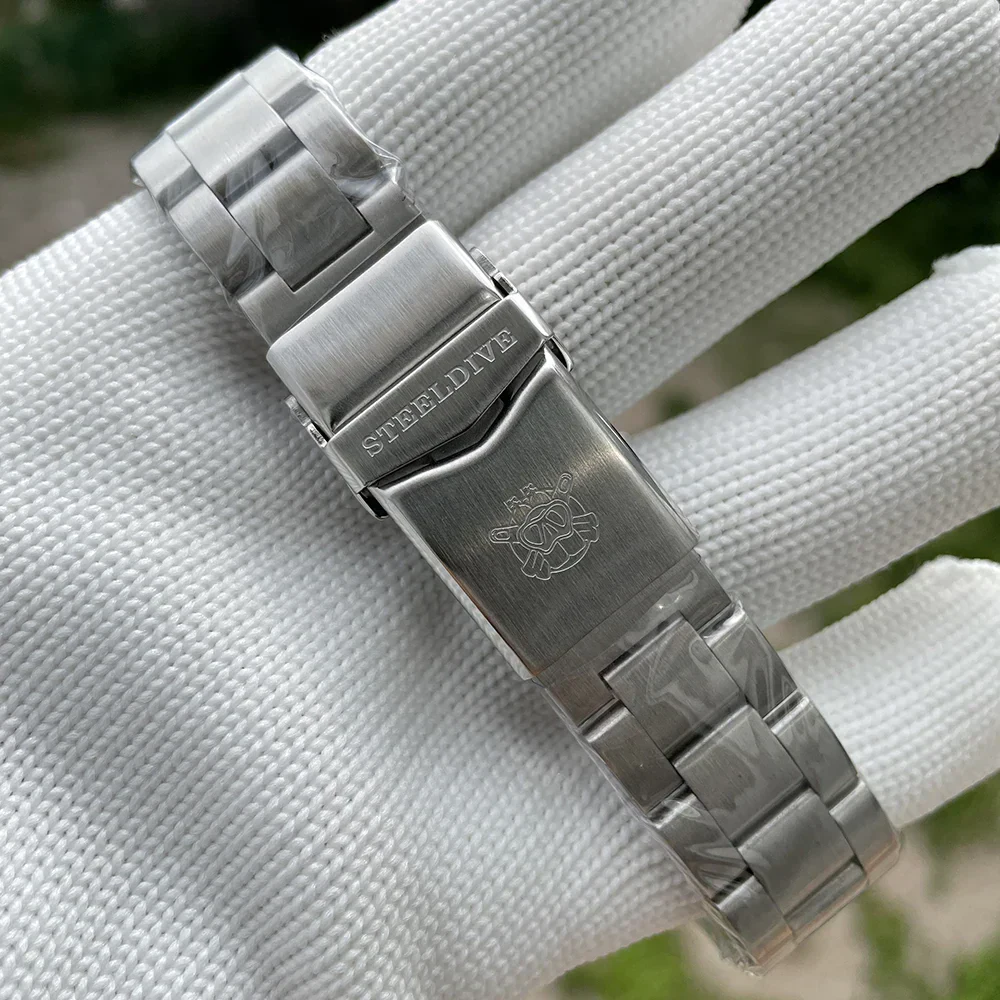 SteelDive Water Ghost watch with stainless steel bracelet and engraved clasp.