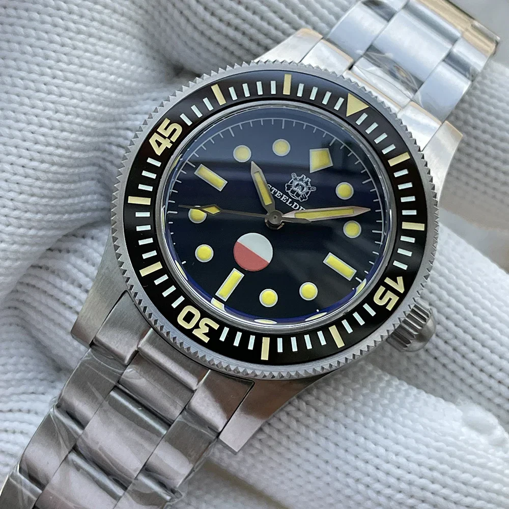 Stainless steel dive watch featuring a black dial, luminous markers, and rotating bezel for underwat.