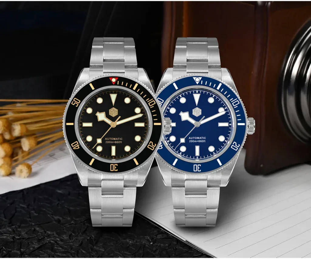 San Martin dive watches with black and blue dials, stainless steel bands, and automatic movement.