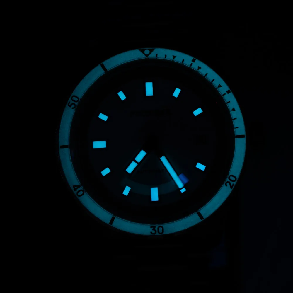Luminous diver watch with glow-in-the-dark hands and markers.