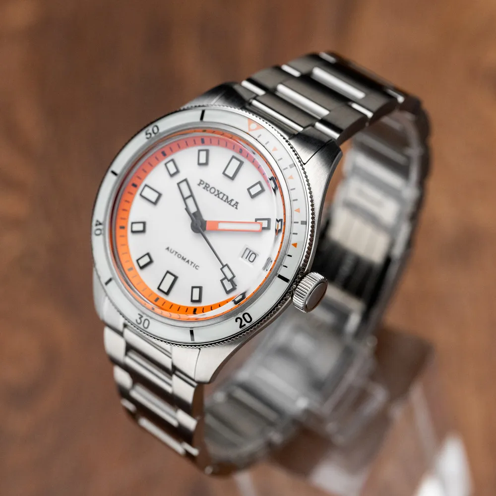 Elegant stainless steel diver watch with luminous hands and orange accents. Waterproof and durable f.