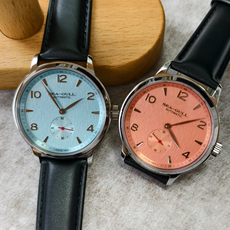 Men's Seagull automatic wristwatch with blue and pink dial, leather strap, 5ATM waterproof.