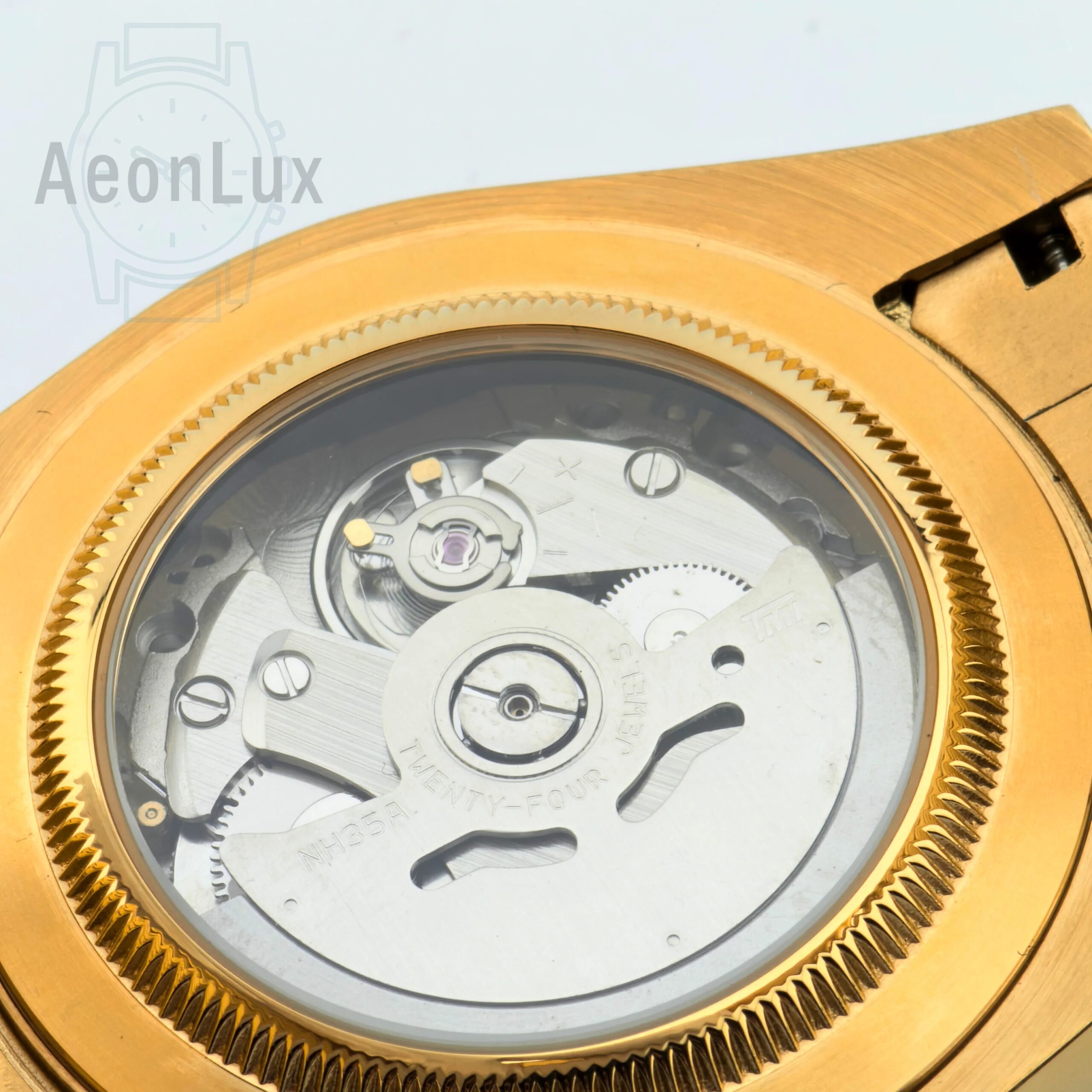 High-end men's gold watch with automatic movement and sapphire glass.