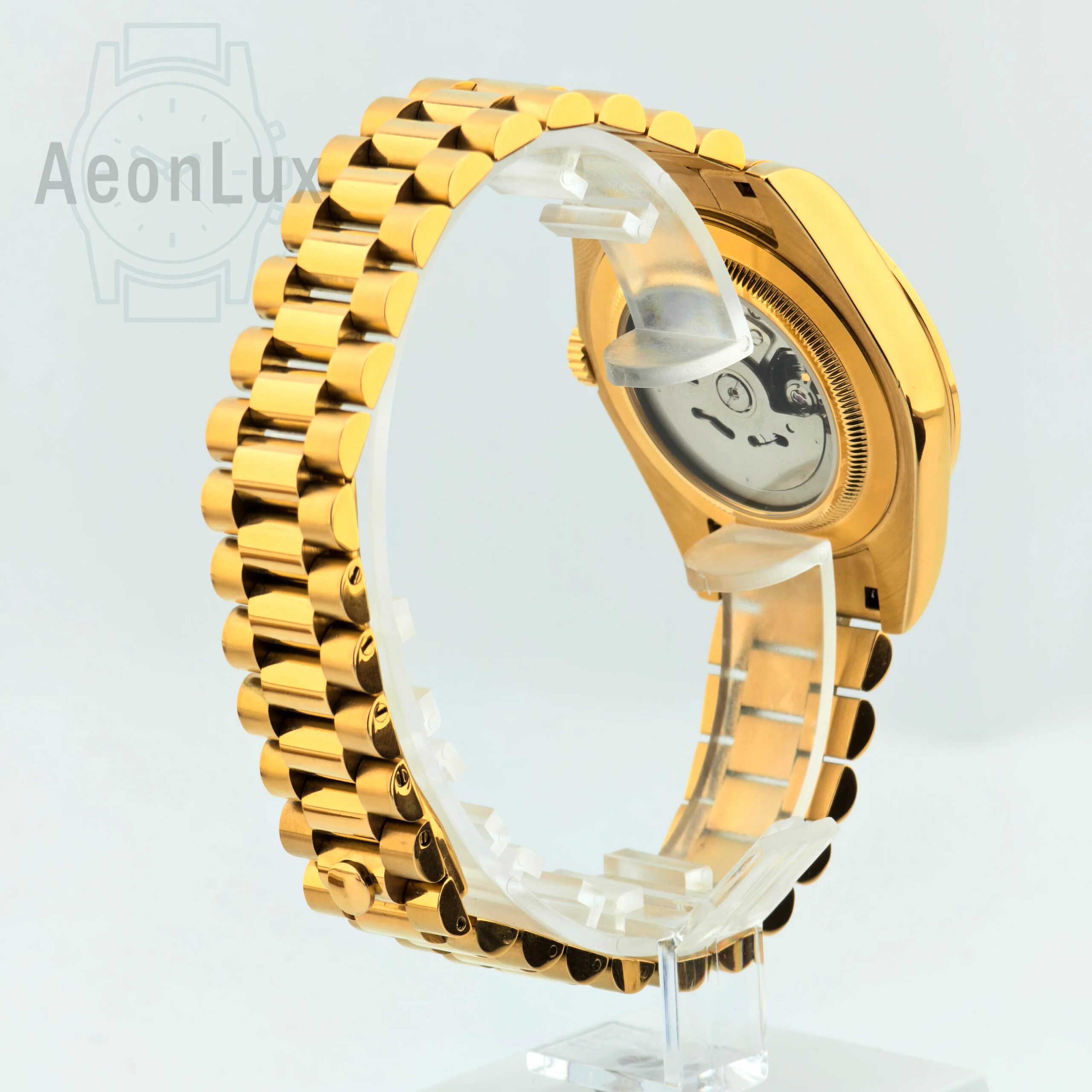 Luxury men's gold watch with sapphire crystal and automatic movement.