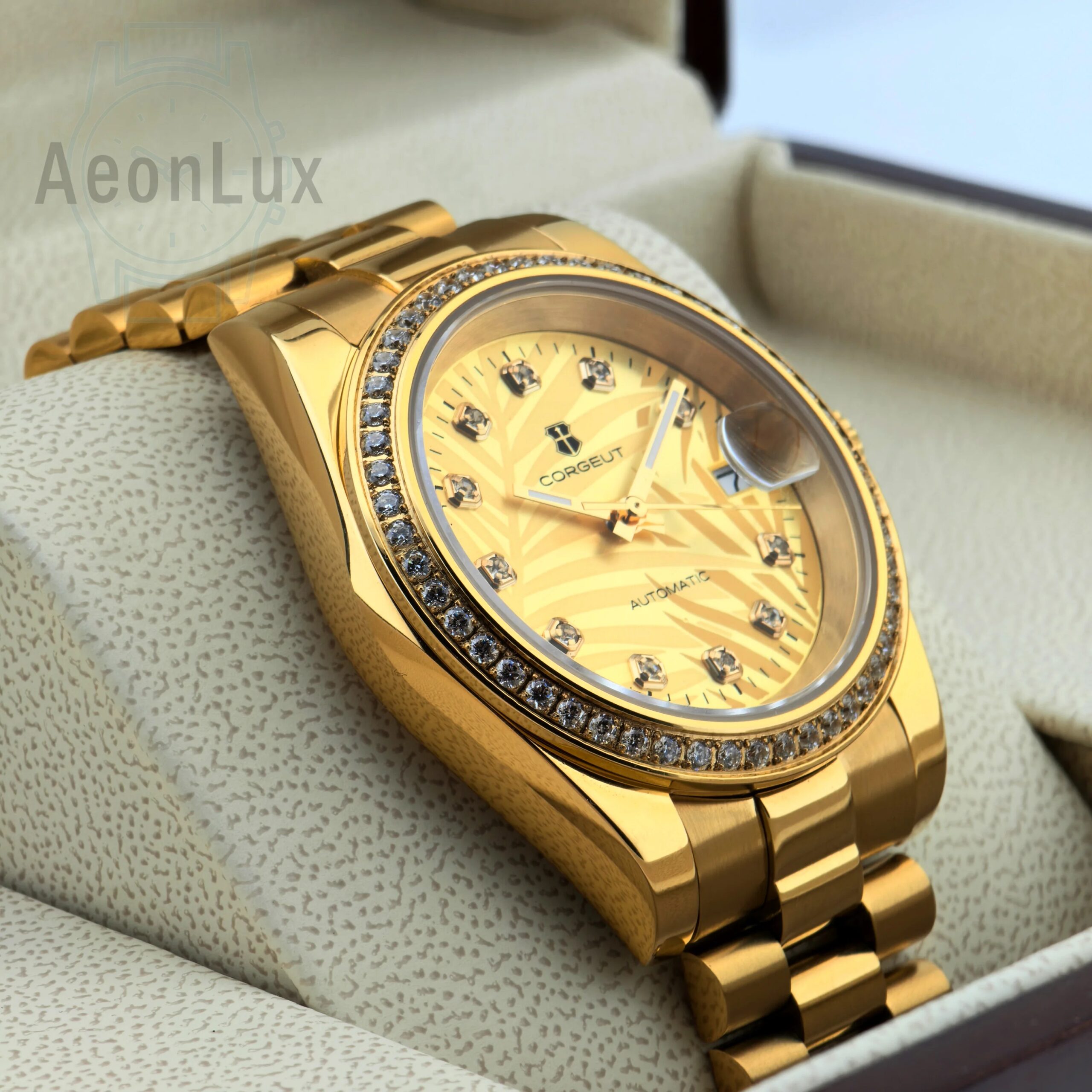 Gold men's luxury watch with diamond-studded bezel and sapphire glass. Automatic movement, calendar.