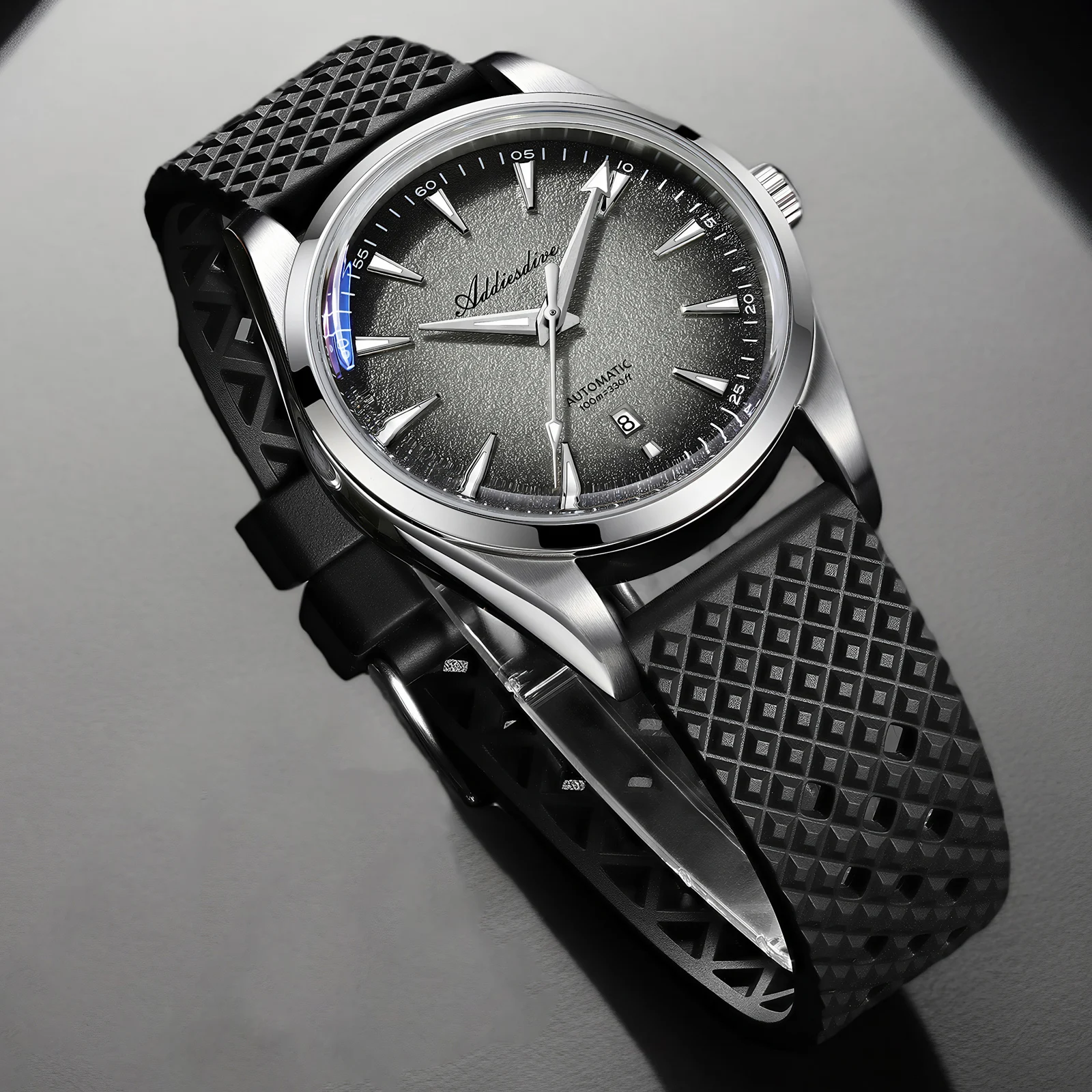 Automatic men's watch with blue luminous dial and stainless steel case.