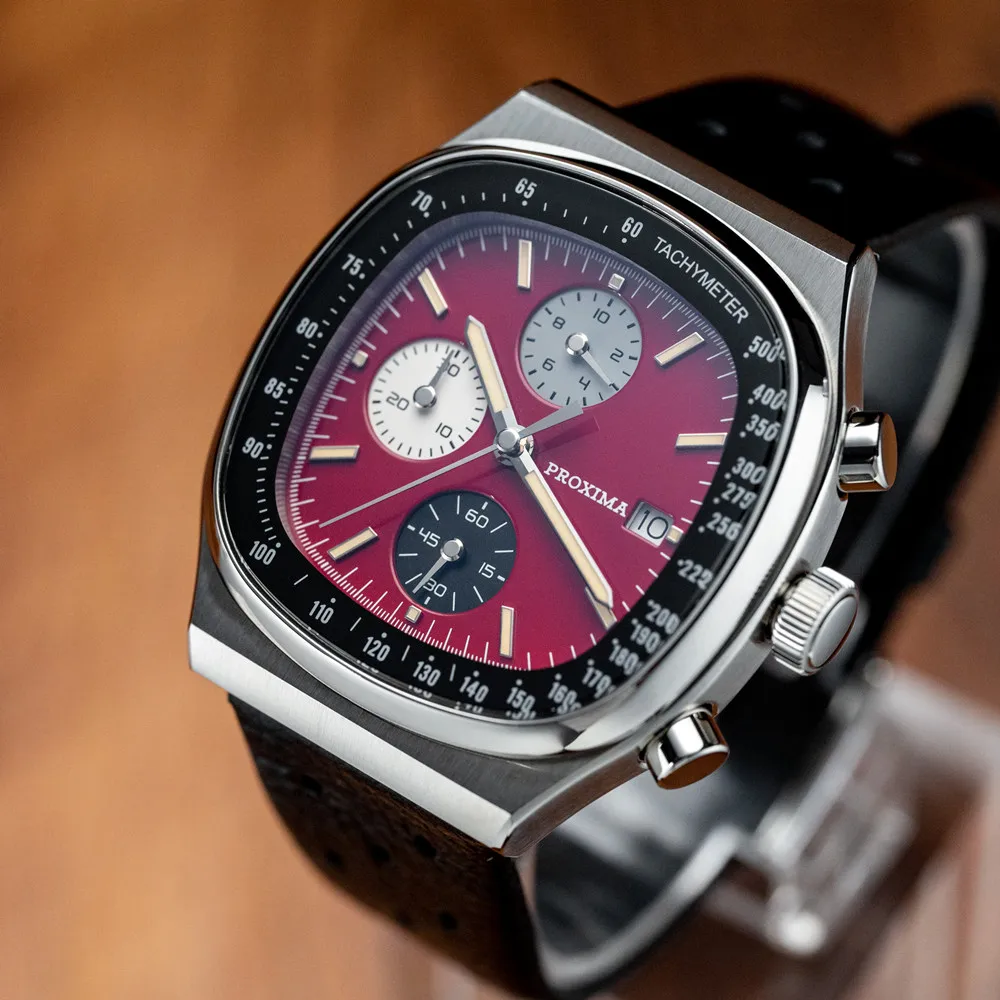Vintage chronograph watch with burgundy dial and stainless steel case.