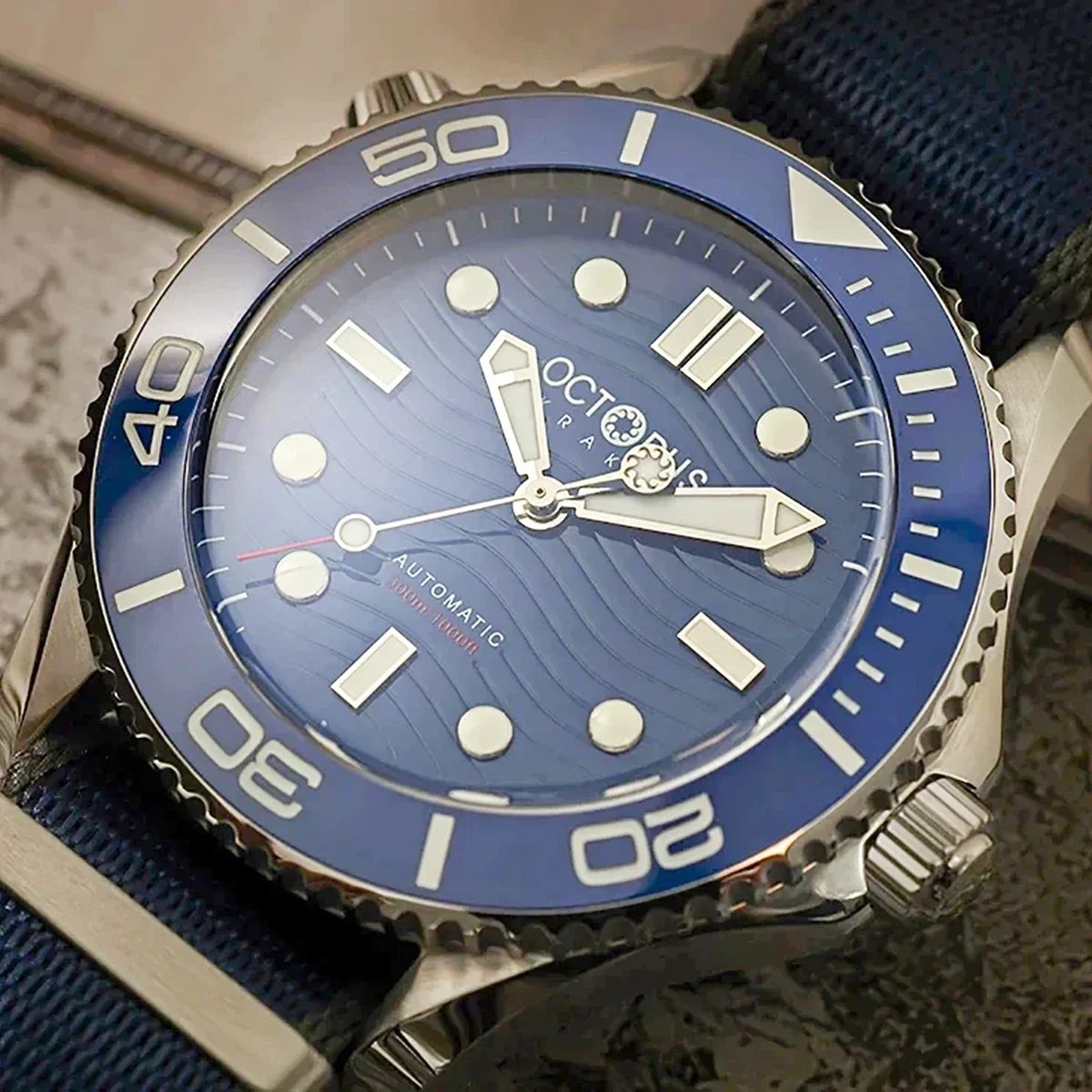 Octopus dive watch with blue dial, luminous markers, and rotating bezel for underwater adventures.