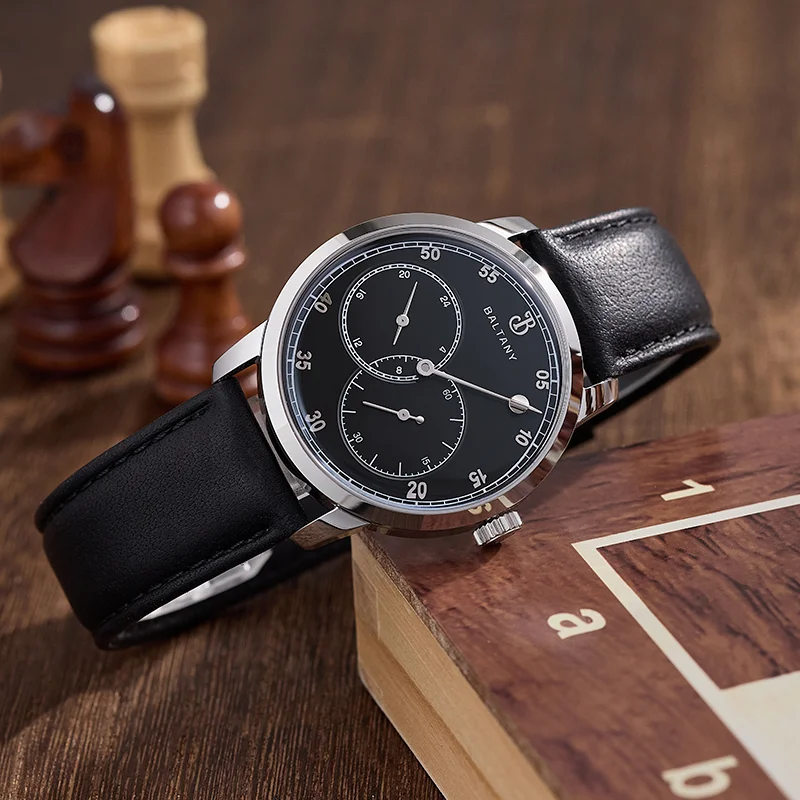 Elegant black leather strap watch with chronograph and silver case, perfect for stylish men.