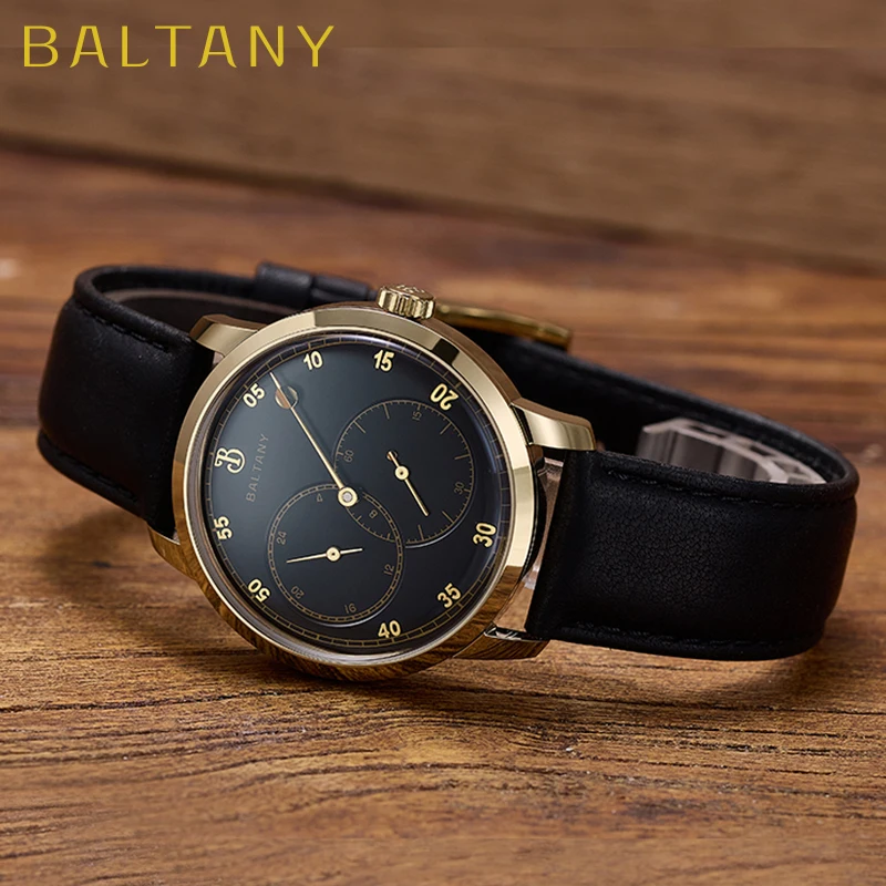 Luxury men's watch with black leather strap and gold-tone case, featuring chronograph functions.