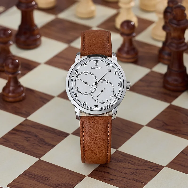 Men's leather strap watch with minimalist design and chronograph features.