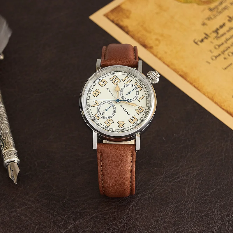 Classic leather strap wristwatch with chronograph and large dial.