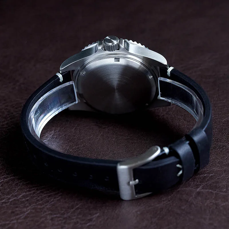 Elegant silver wristwatch with black leather strap for men.
