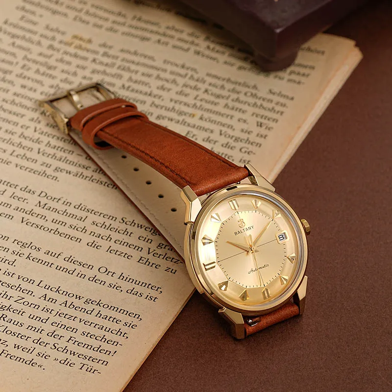 Gold watch with a classic design and brown leather strap, perfect for stylish everyday wear.