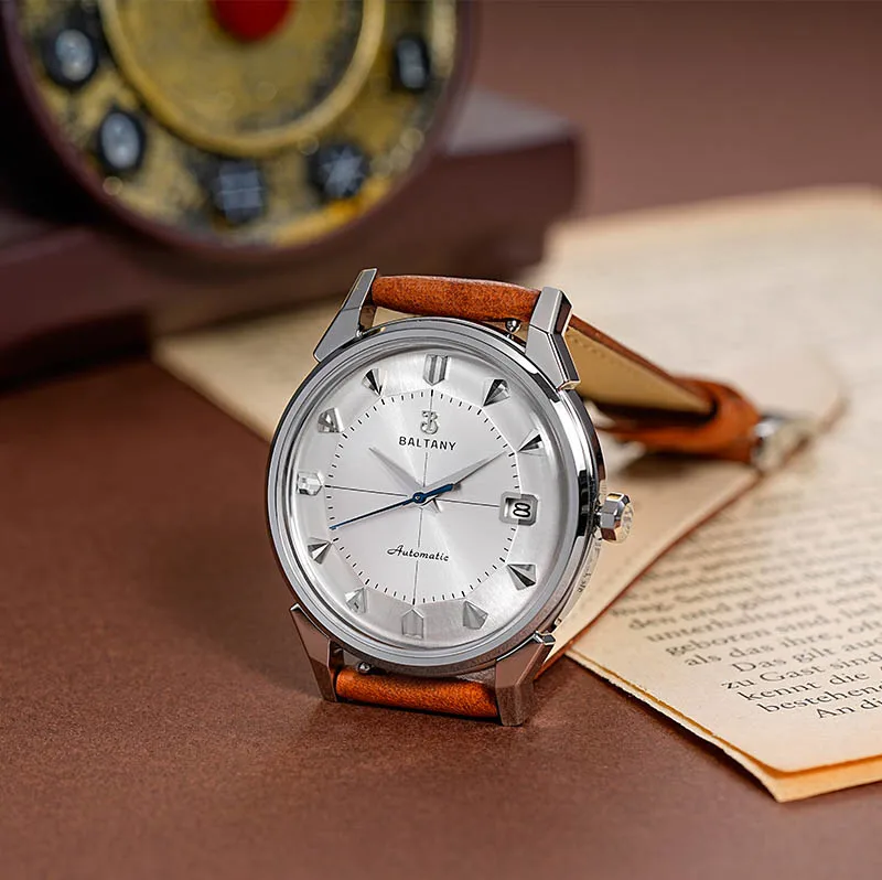 Automatic wristwatch with silver dial and leather strap for men.