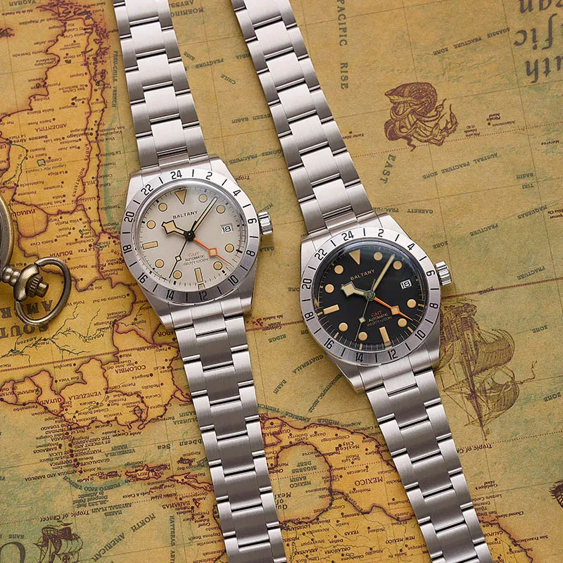 Vintage stainless steel dual time zone watches on nautical map background.