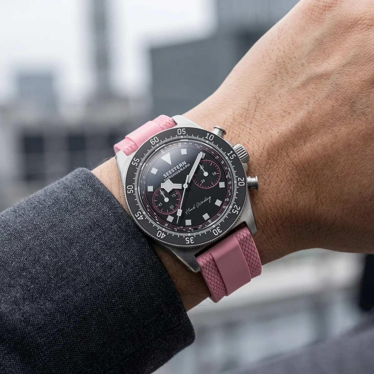 Stylish men's wristwatch with pink silicone strap and black chronograph dial, perfect for modern fas.
