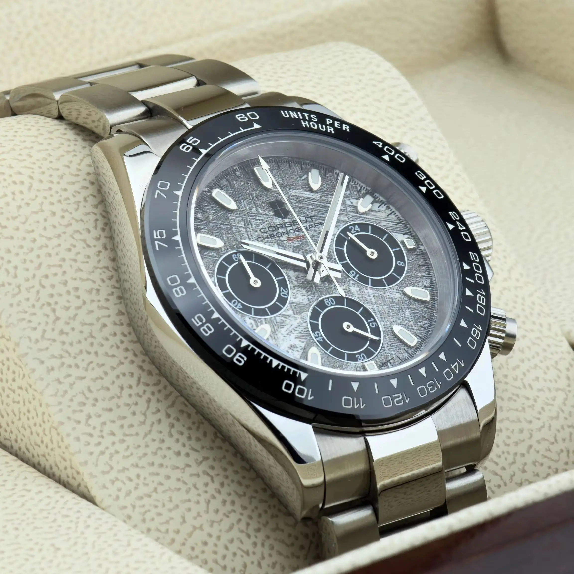 Elegant silver chronograph wristwatch with black dial and stainless steel band.