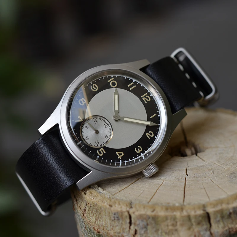 Vintage wristwatch with black leather strap and silver case for men and women.