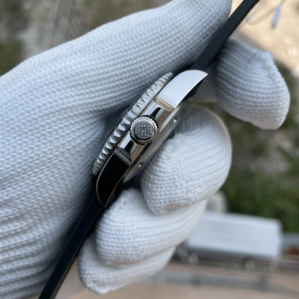Luxury wristwatch with black strap and silver case, close-up shot.