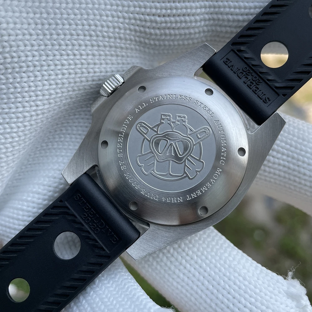 Engraved pig logo wristwatch with stainless steel case and black rubber strap.