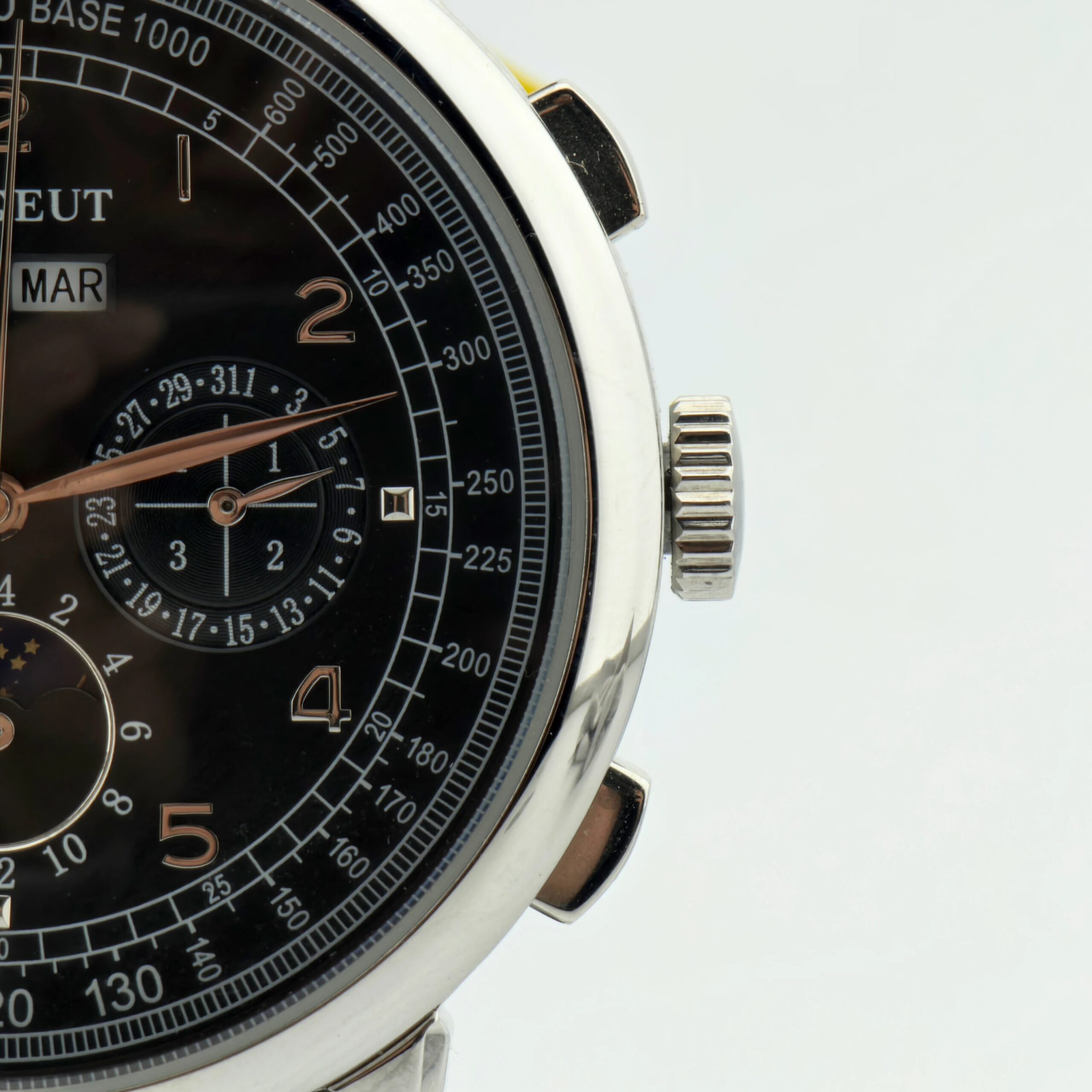 Luxury men's chronograph wristwatch with black dial, silver case, and multiple sub-dials.