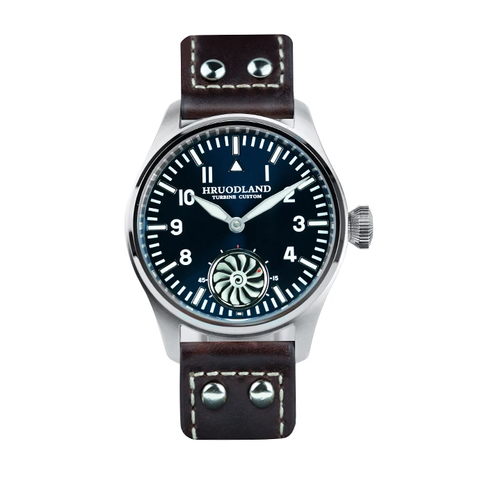 Luxury pilot style wristwatch with leather strap and turbine-inspired dial design.